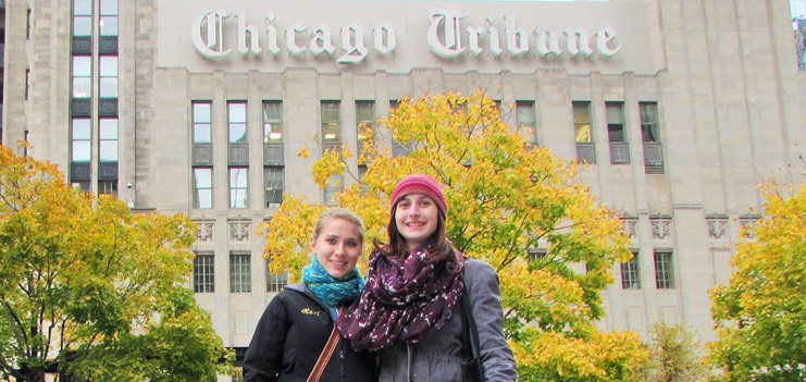 Manchester English majors Kari and Emily pose in front of the Chicago Tribune