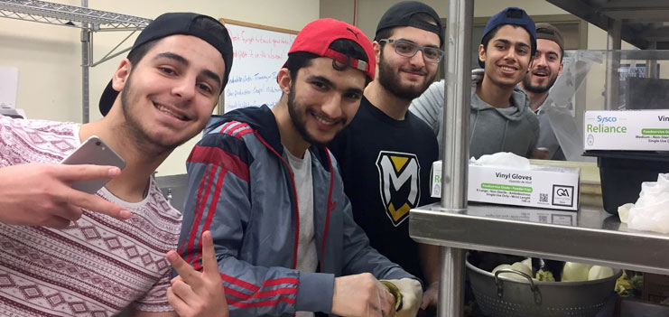 Kurdish students cooking for the international buffet