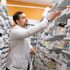 Student stocks pharmacy shelf