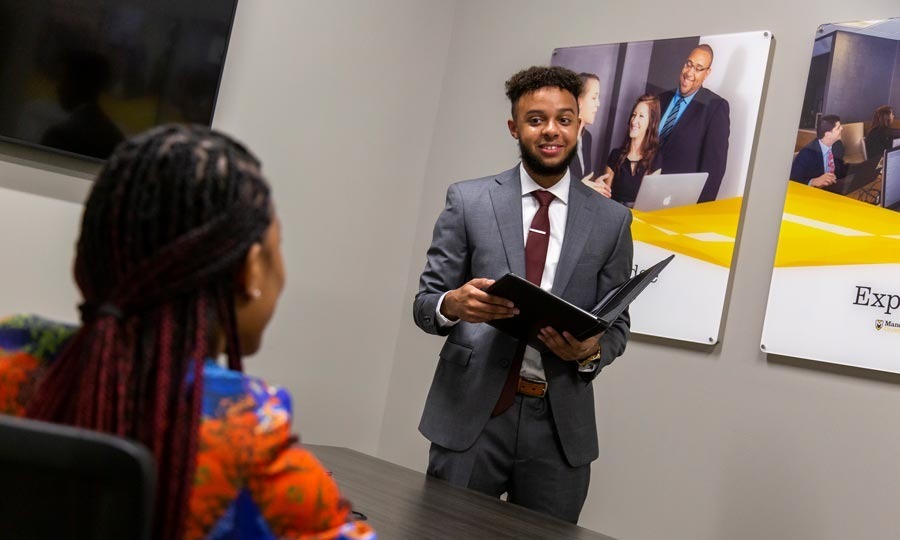 An MU student shares a presentation in the classroom.