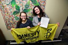 Virginia Rendler and Gabby Anglin Celebrate the Refugees Welcome Resolution
