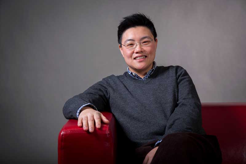 Image of Sun Kang on the MU red chair. 