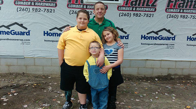 Kling family with their new home Kling family with their new home