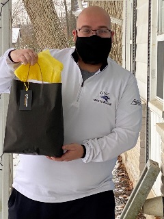 University of Saint Francis athletic trainer Drew Hollman with his hand-delivered thank-you bag. University of Saint Francis athletic trainer Drew Hollman with his hand-delivered thank-you bag.
