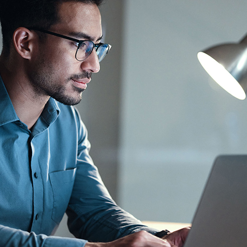 A man studies at his online classroom
