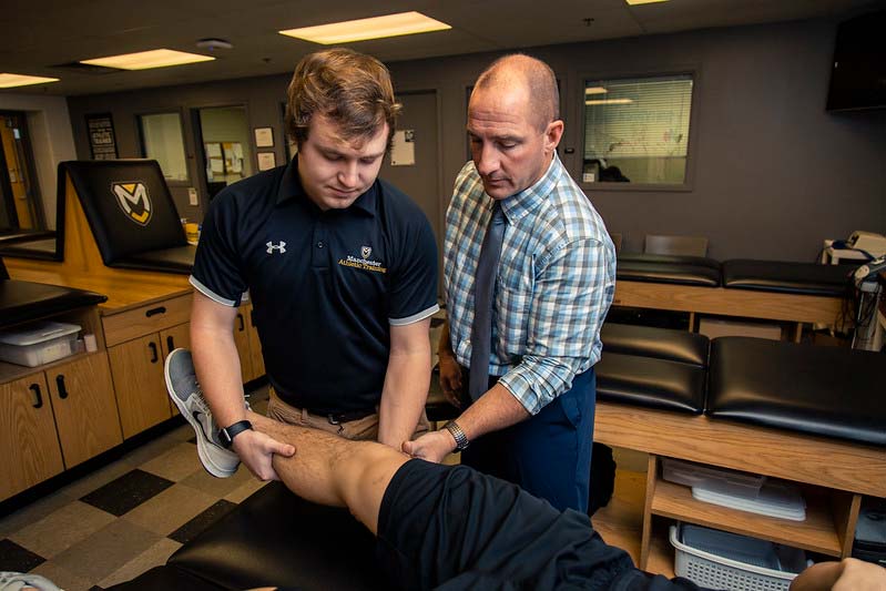 Dr. Jeff Beer instructs a student