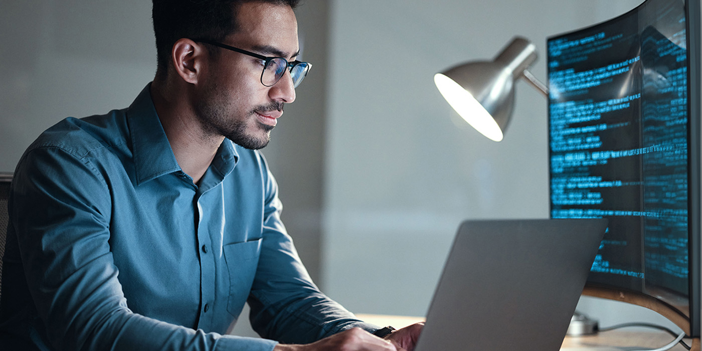 A man in a blue shirt uses online training