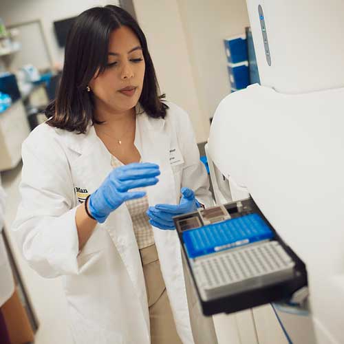 A student using equipment in the PGx department
