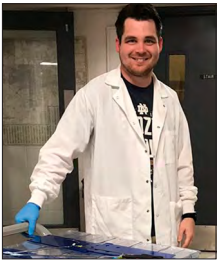 Image of Joseph Chambers with Zebrafish in ManchesteRx Magazine