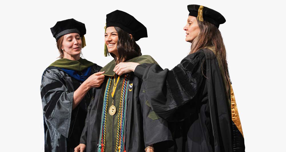 A student enjoys the MU Hooding Ceremony with the Pharmacy Program.