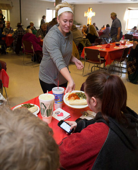 Manchester University students serve those who come to the Community Dinners in North Manchester.