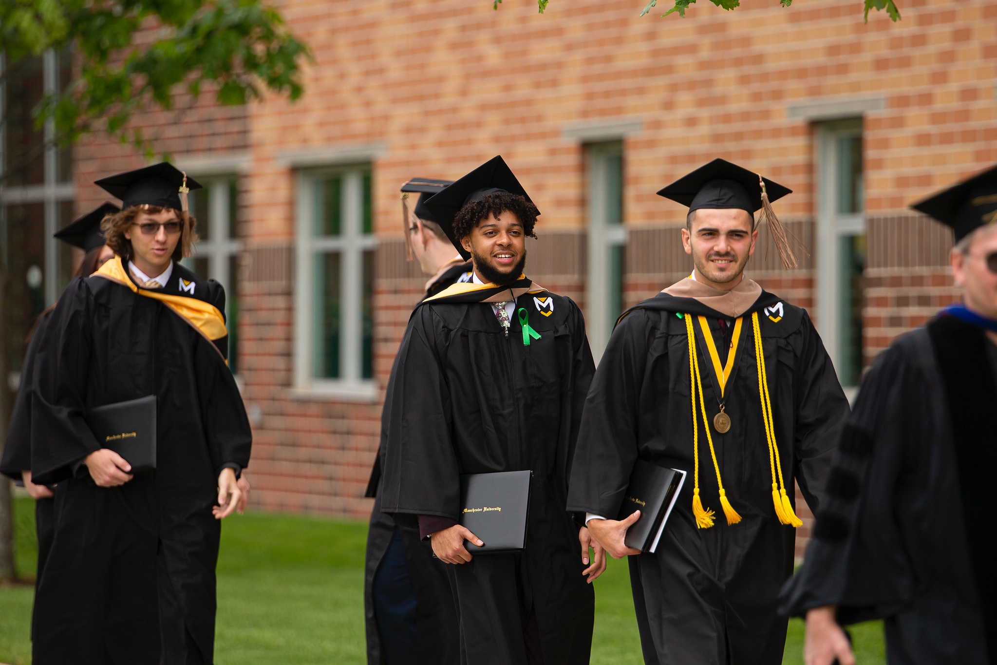Commencement students walking outside