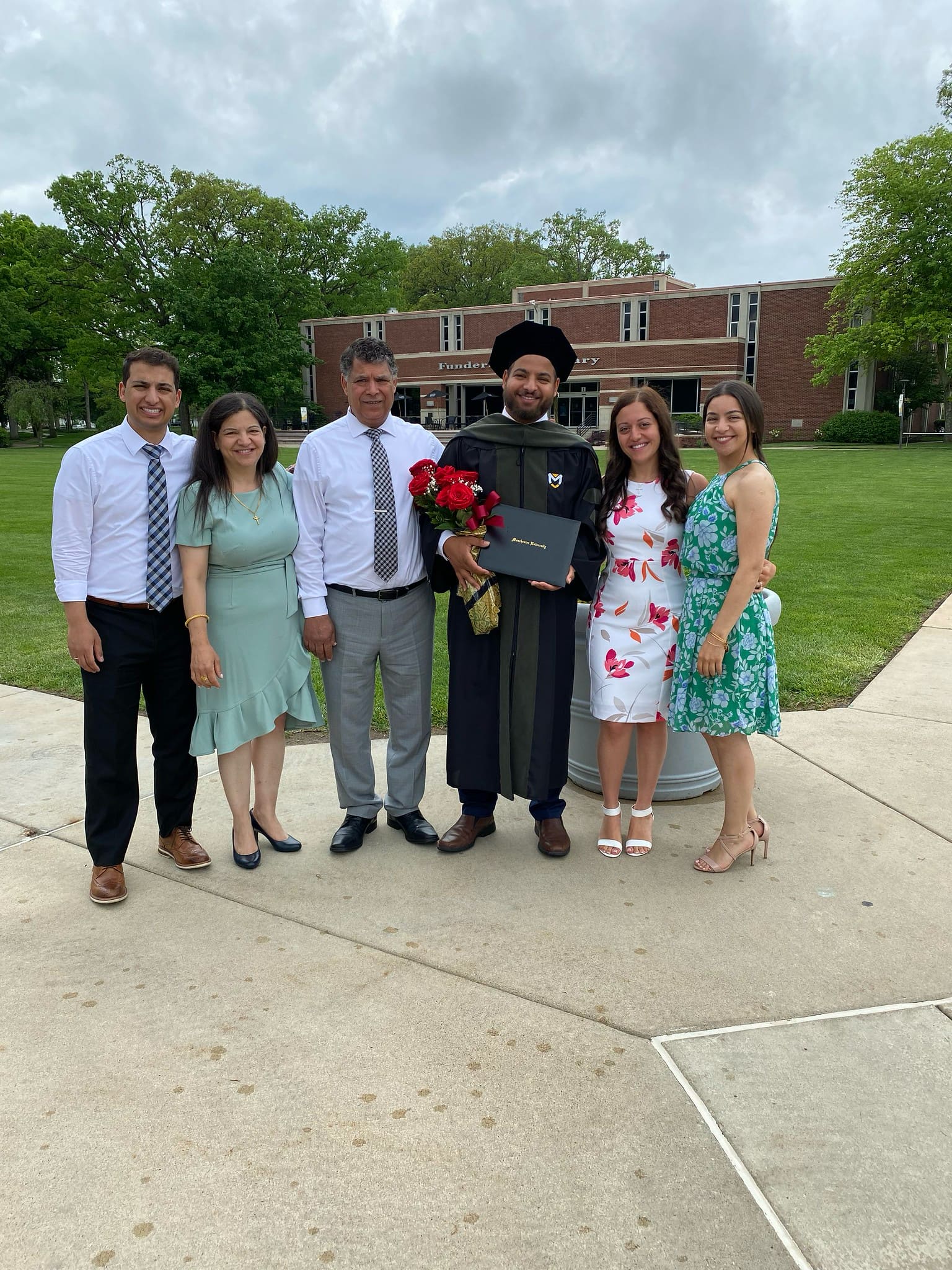 Commencement student outside with family