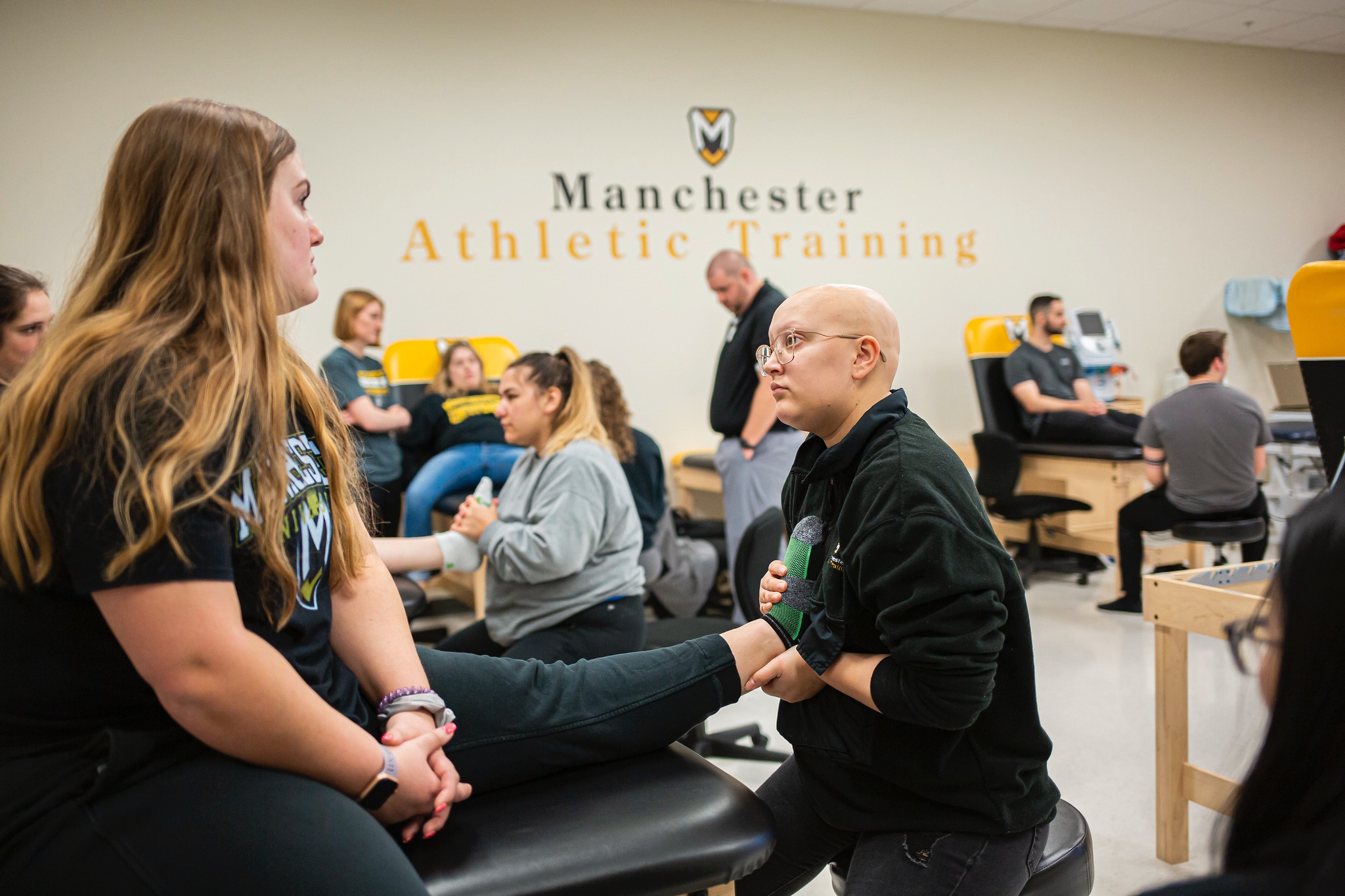 Athletic Training students in lab classroom with professor