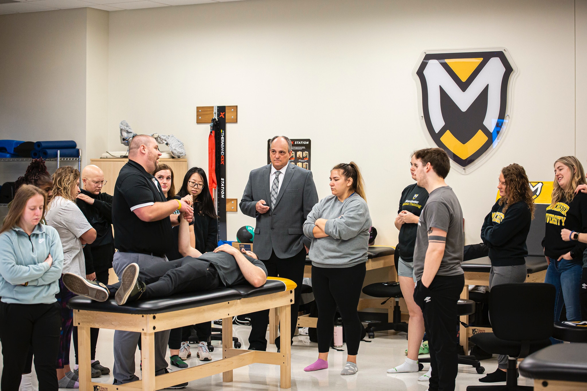Athletic Training students in lab classroom with professor