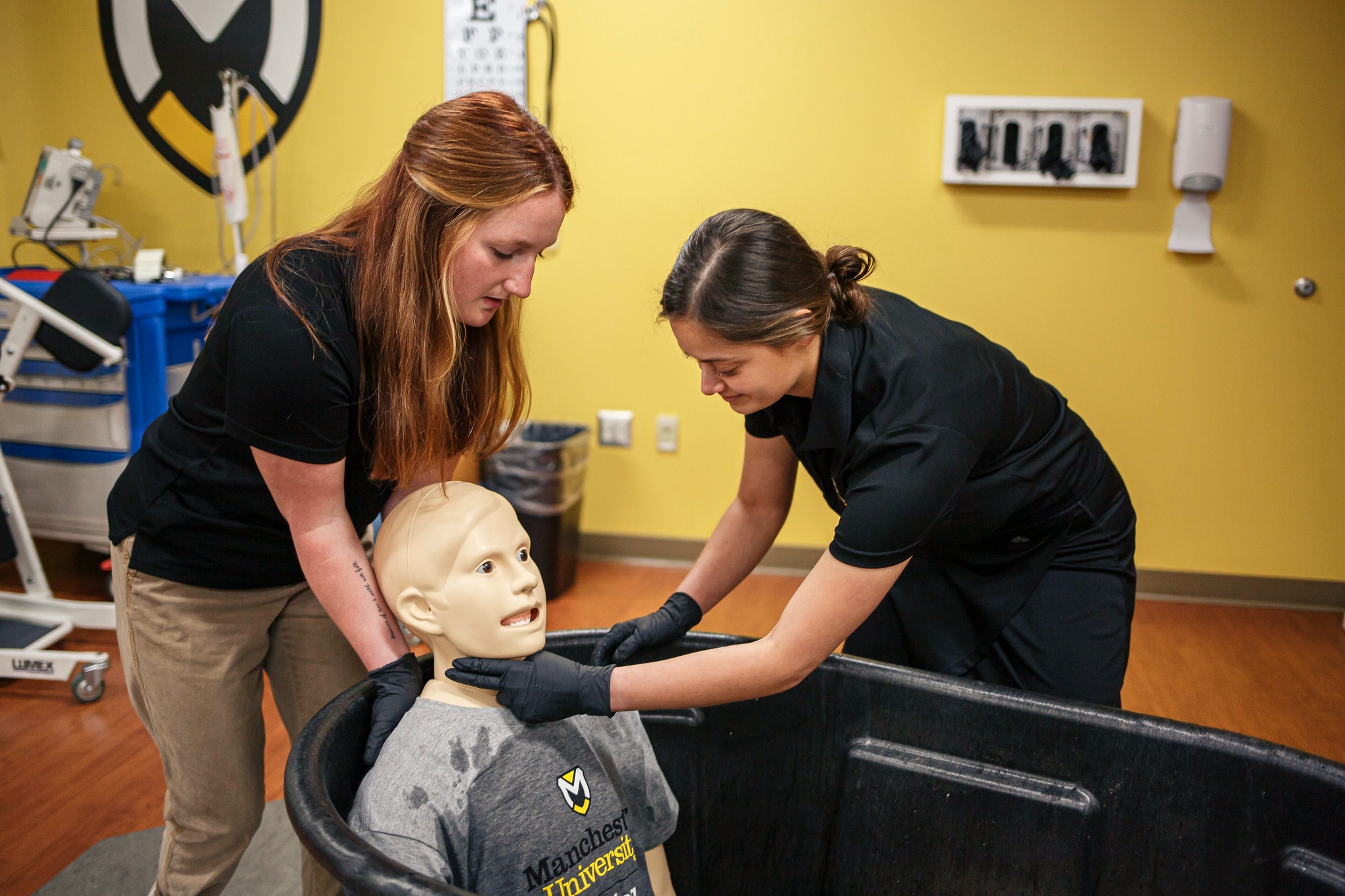 Athletic Training female Students with manikin