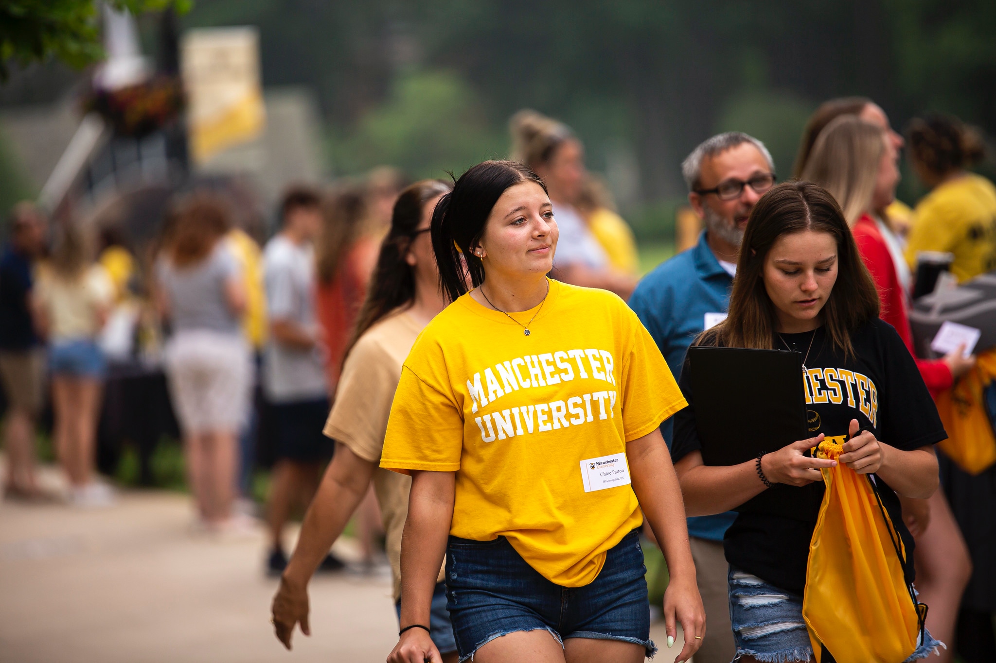 Black and Gold Visit Day students and parents walking outside on campus Black and Gold Visit Day students and parents walking outside on campus