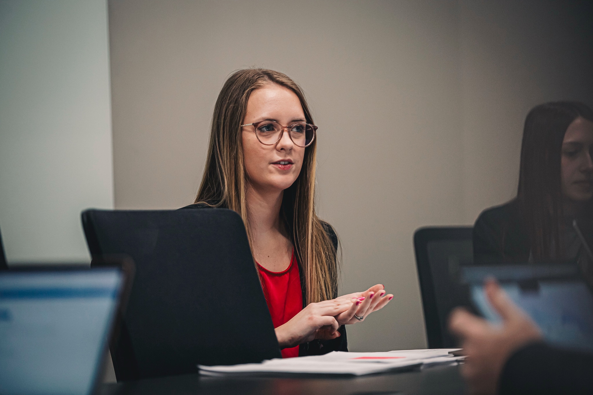 female business student talking in room