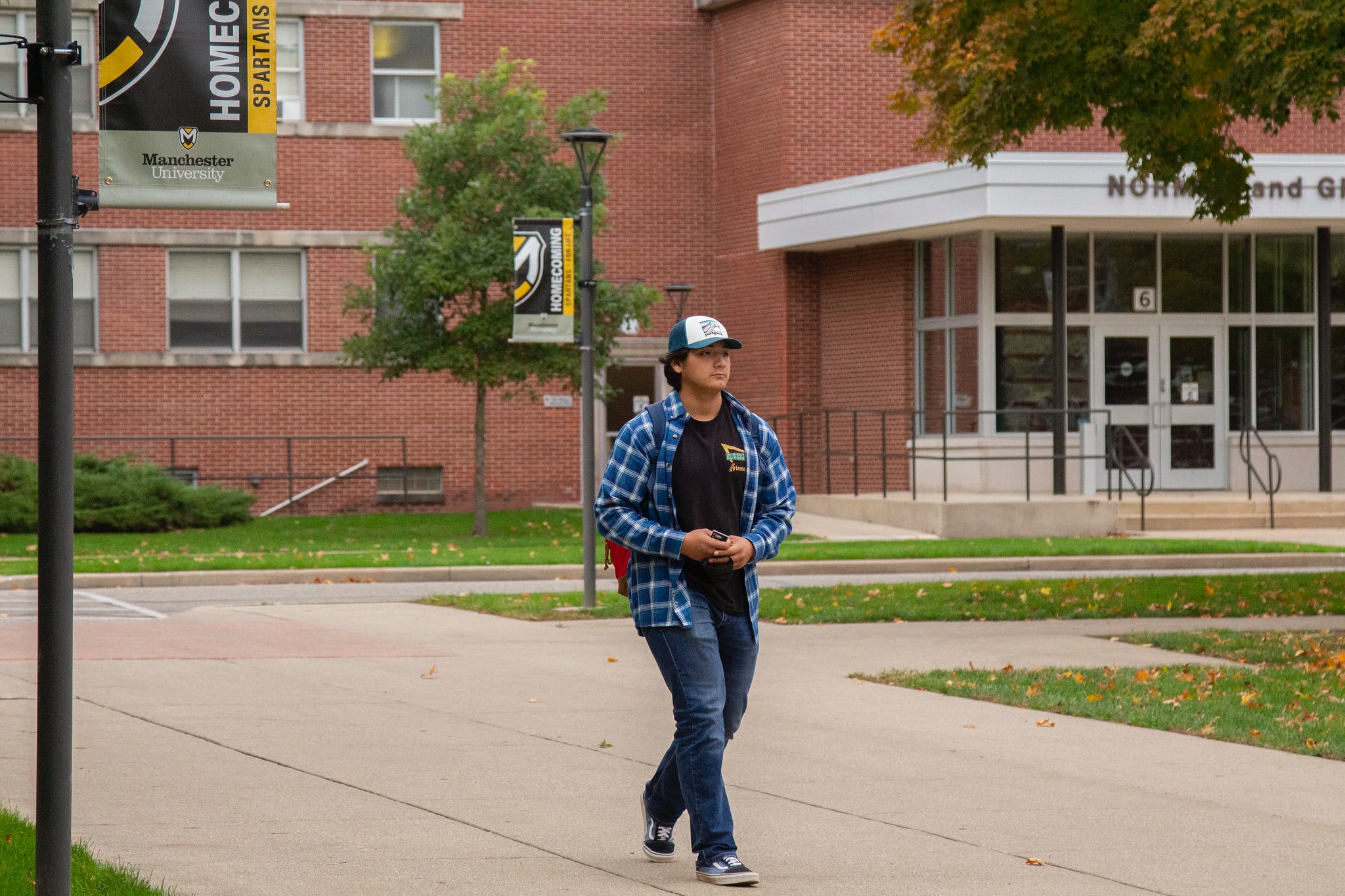 male student walking on campus