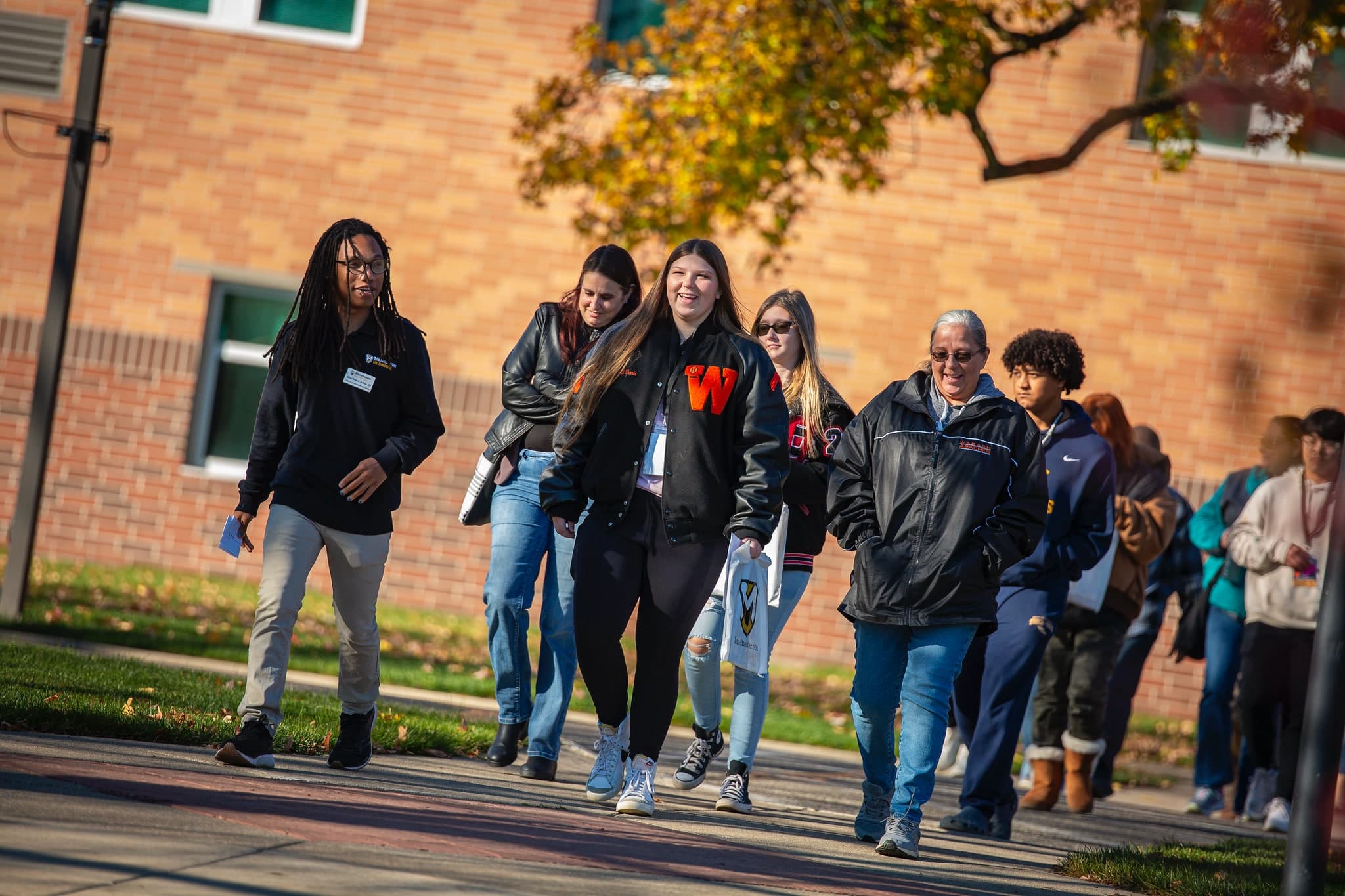 Campus Visit Day famlies outside walking on tour on visit day famlies outside walking on tour on visit day
