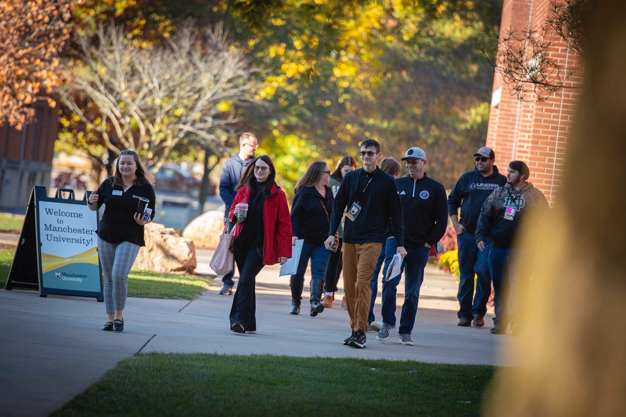 families outside walking on tour on visit day