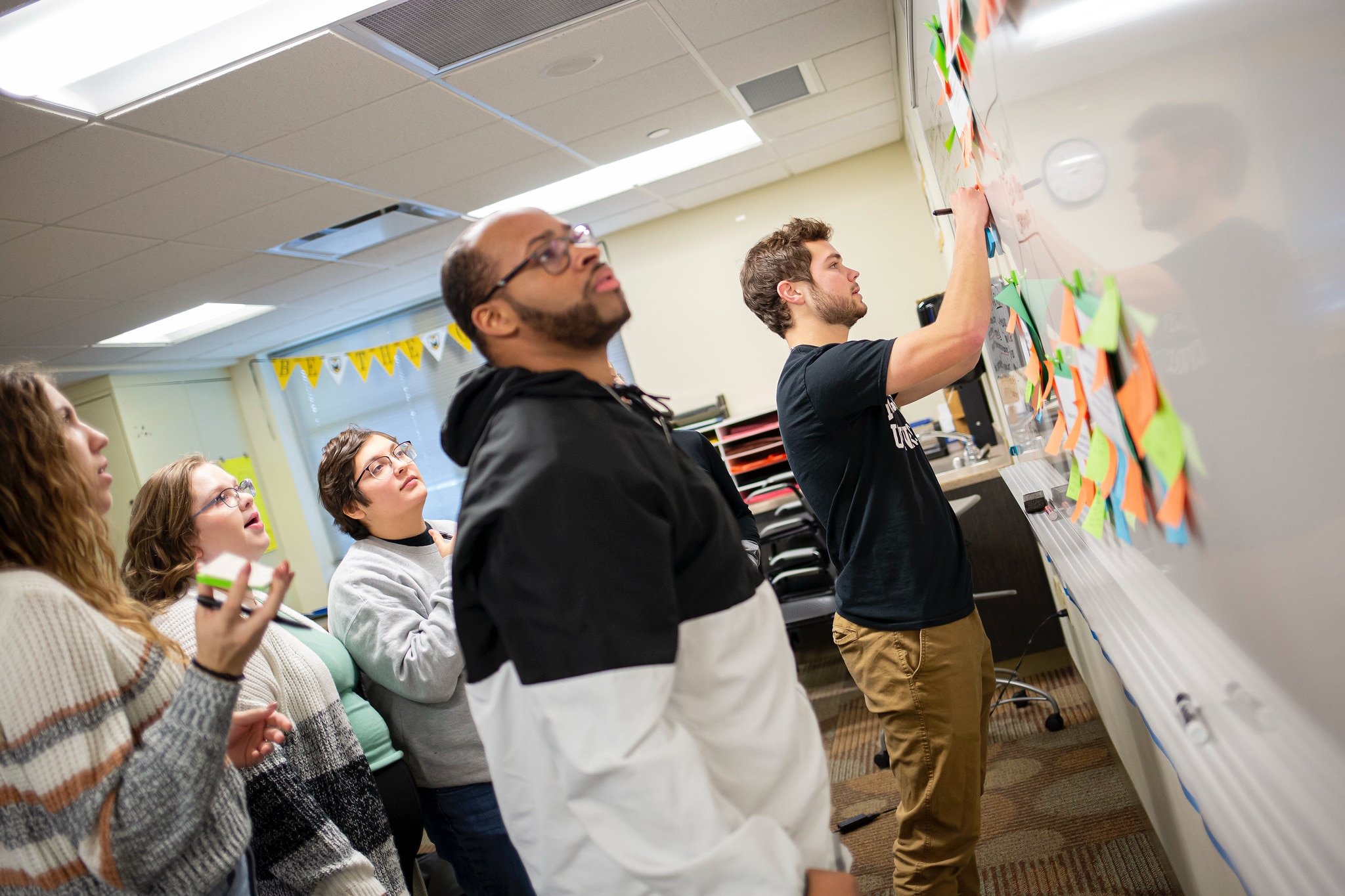 Education students at the board