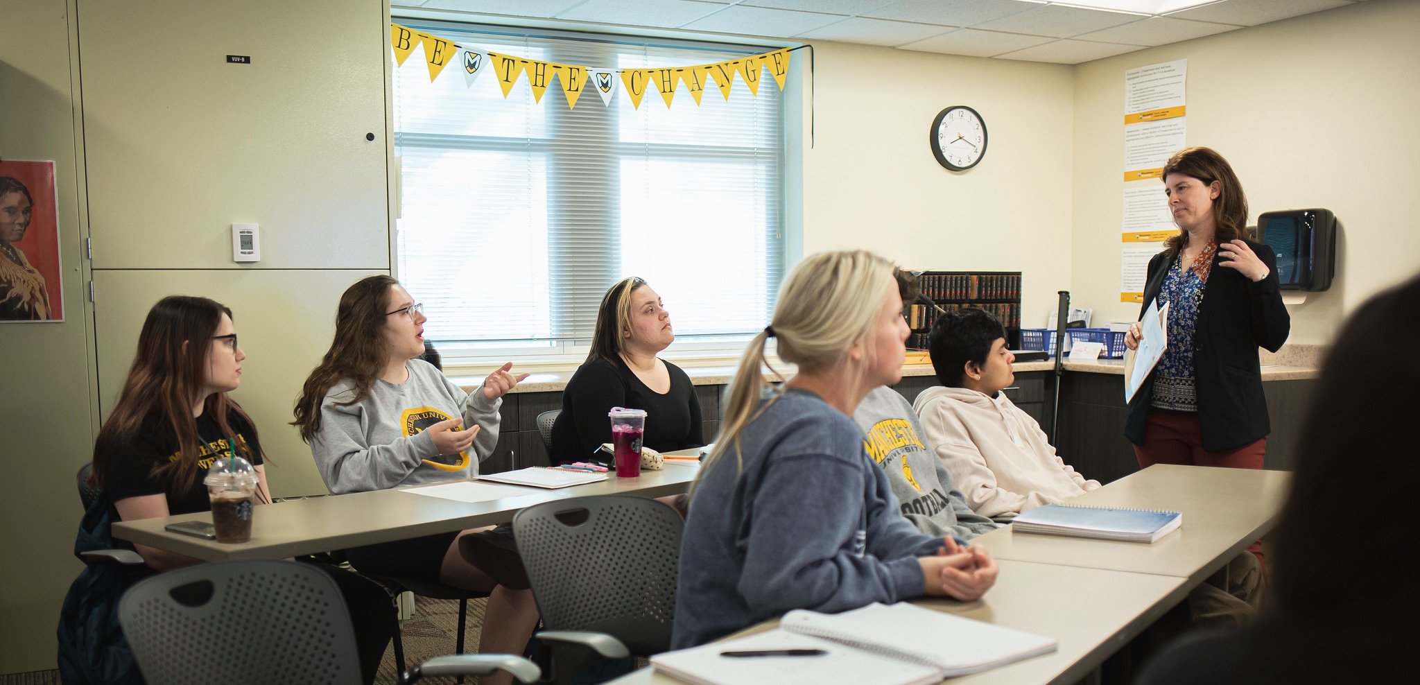 Education class inside with students and professor Education class inside with students and professor
