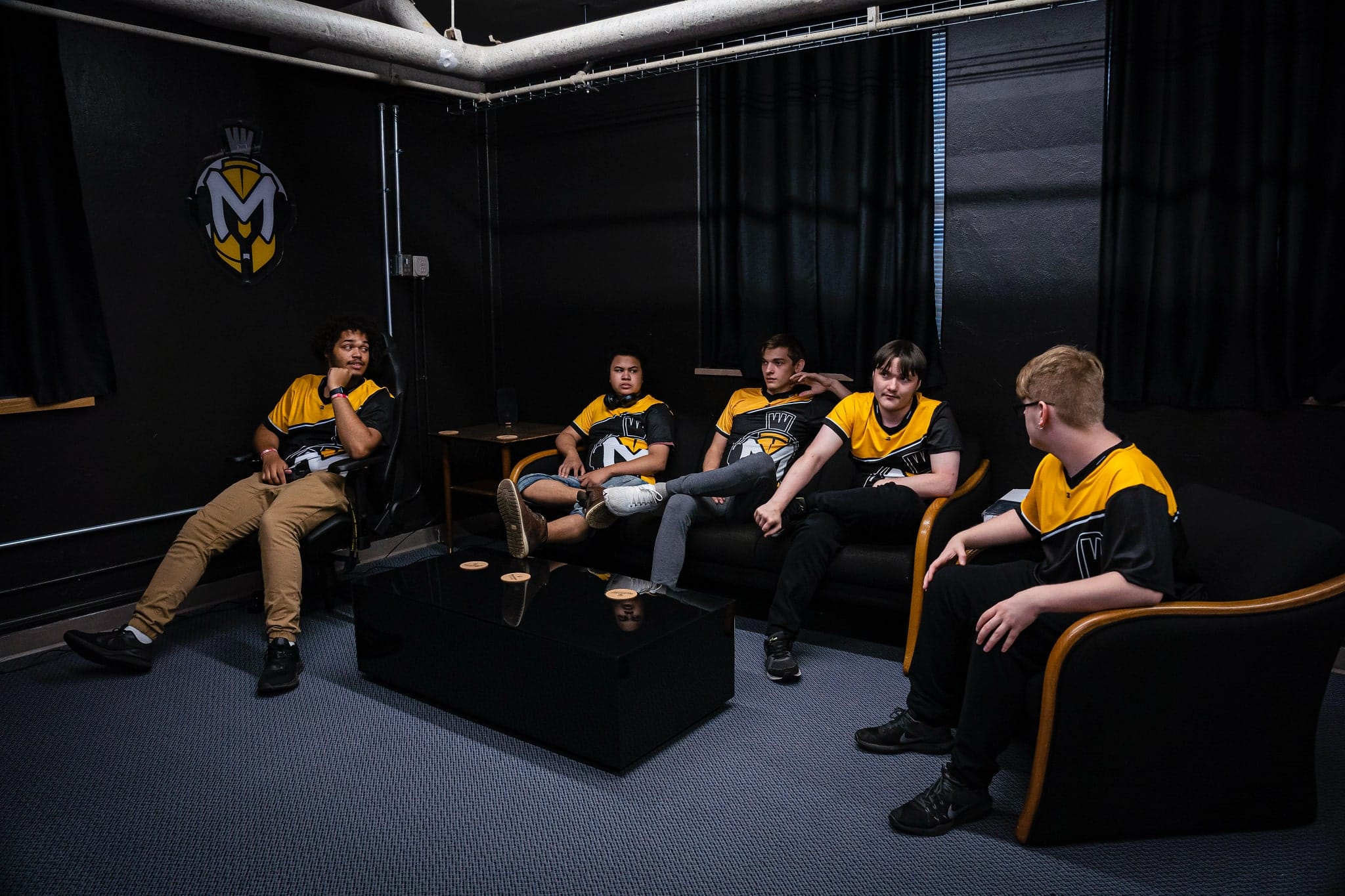 Esports five male students talking