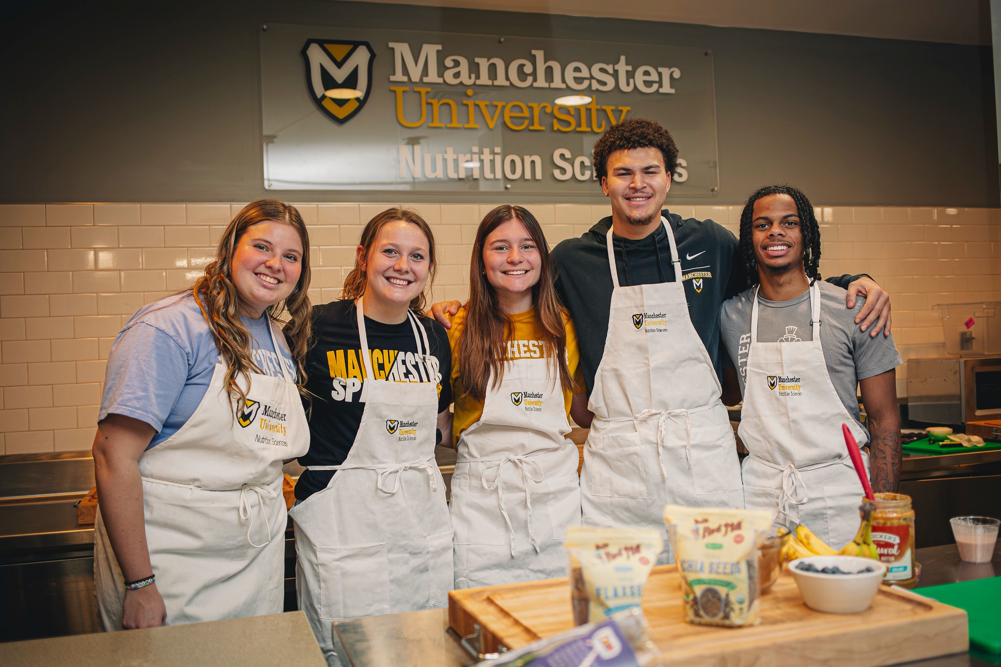 a group of nutrition students pose for a photo during class
