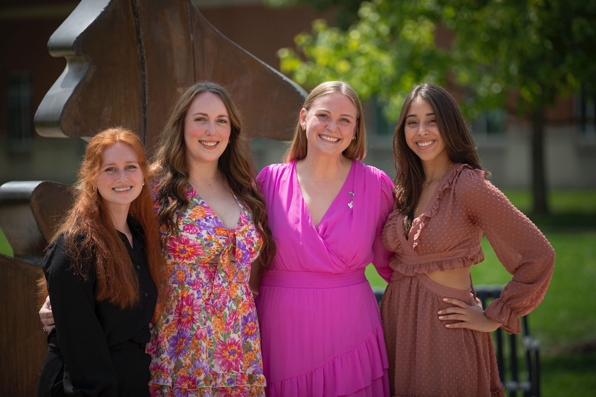 Pharm-Nursing-Ceremonies-7 a group of female nursing and pharmacy students pose for a photo at a ceremony