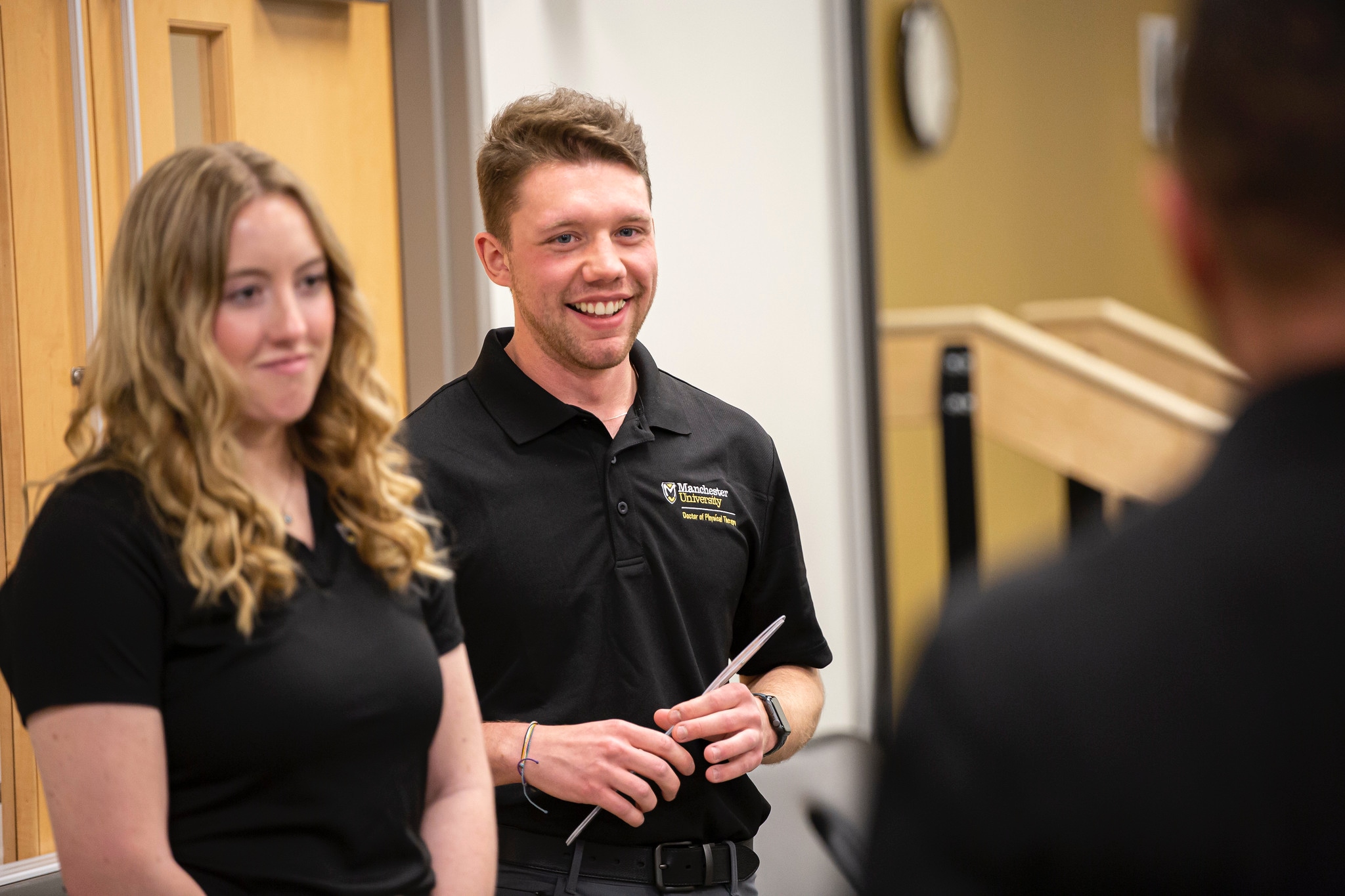 two physical therapy students pose for a picture together