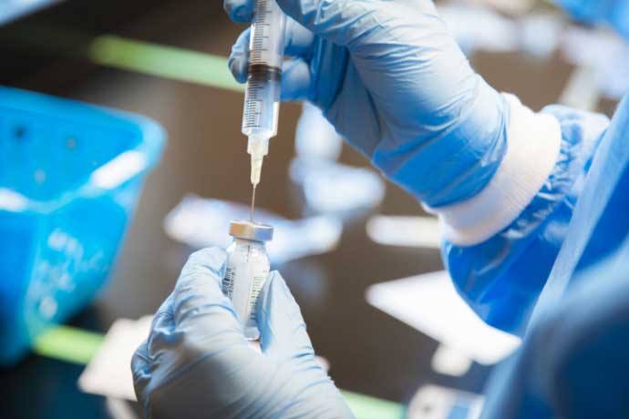 program-benefit-syringe syringe inserted in vial