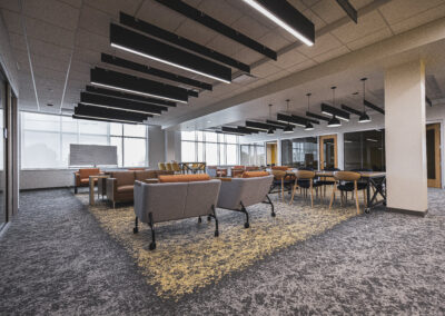 Open lounge area at the Fort Wayne Campus with couches, tables, and chairs