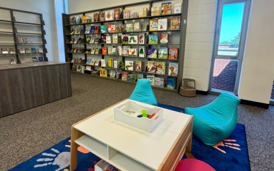 Literacy Lab with bean bag chairs, kids' toys, and bookshelves