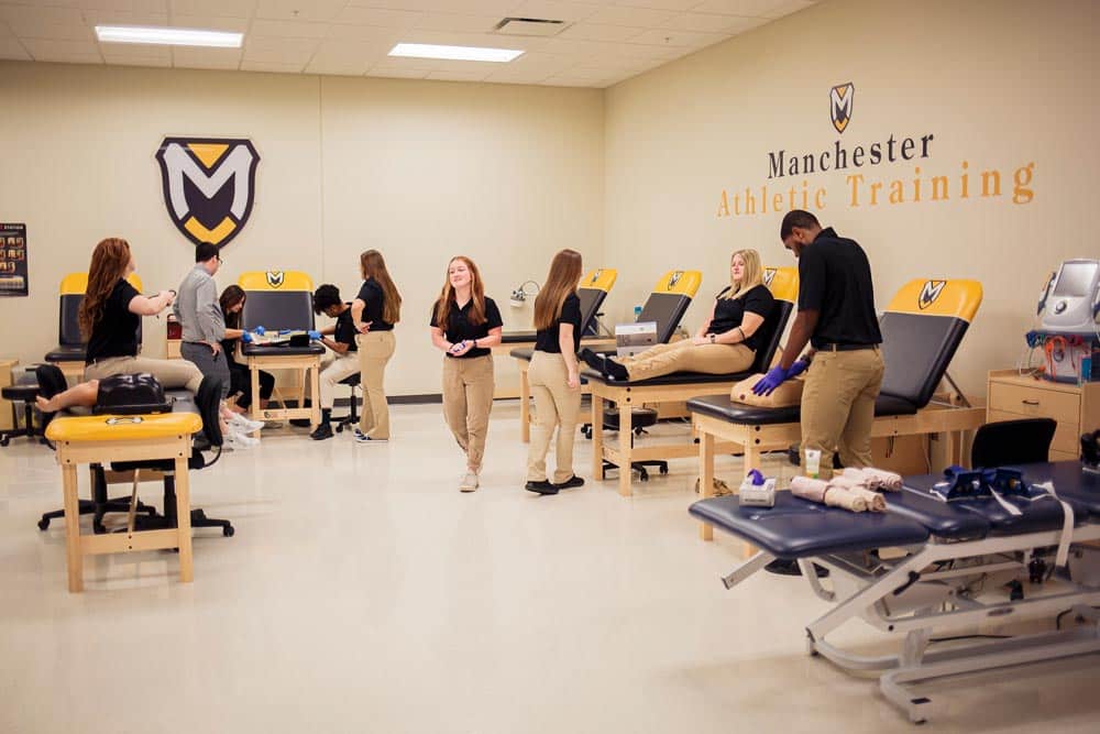 MAT_Lab_Wideshot This image shows the Manchester University Fort Wayne Master of Athletic Training (MAT) Lab with students
