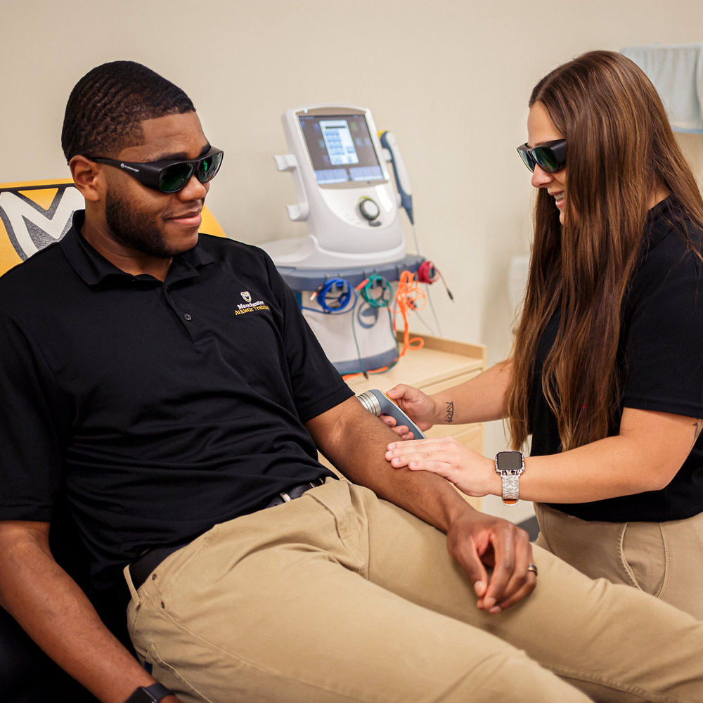 Students practice in the Master of Athletic Training lab at Manchester University Fort Wayne.