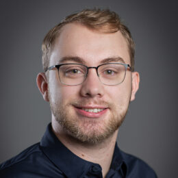 smiling man who is head coach of Esports team