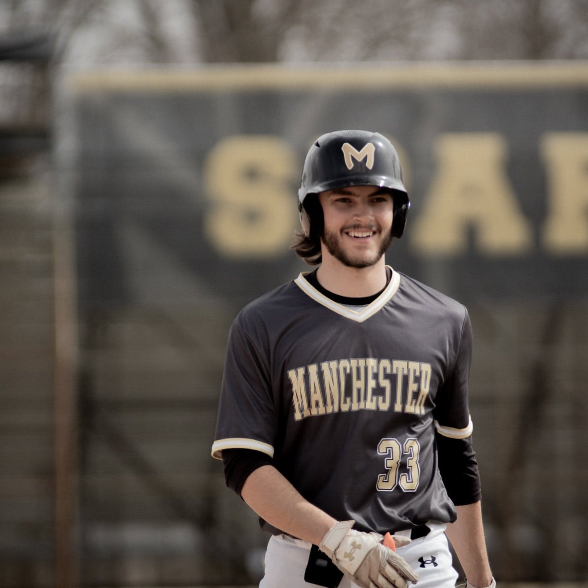 MU Baseball #33 is seen smiling on his way back to the dugout.