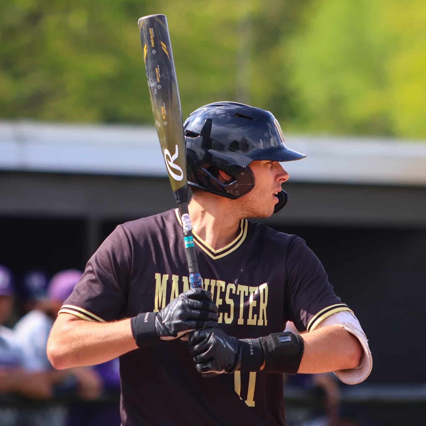 A Manchester player in a close-up ready at bat.