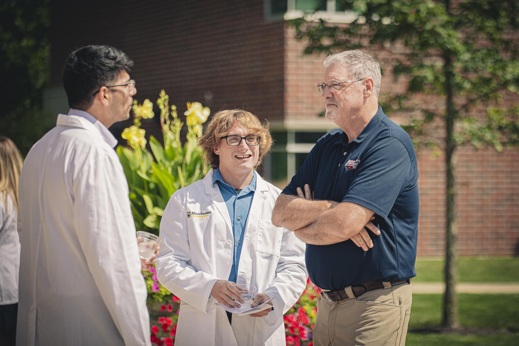 53956547025_657d4dcd36_k physical therapy students wearing polos looking at the screen of a treadmill