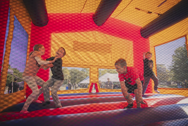 kids enjoy the bounce house supplied during the festivities at Homecoming 2025