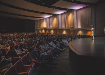 Holocaust survivor Irene Miller talking to Manchester University students, staff, and community members about her experiences during World War II