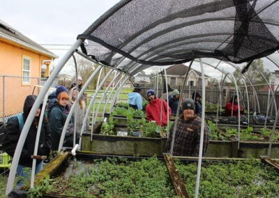 Manchester University students visiting a community garden in New Orleans to learn about effective community organization