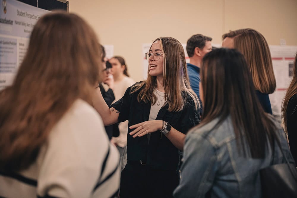 A female student presents in the Upper JYSC at Manchester University's North Manchester Campus.