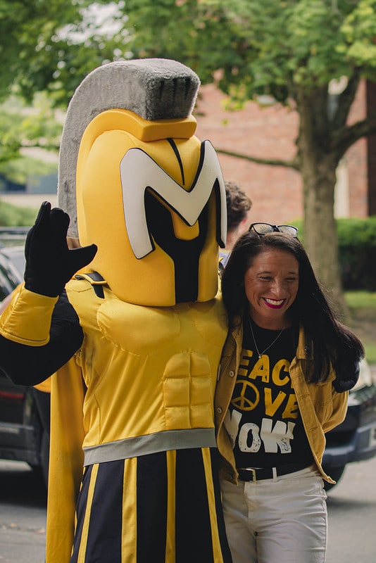 Manny poses with president Stacy Young for a photo.