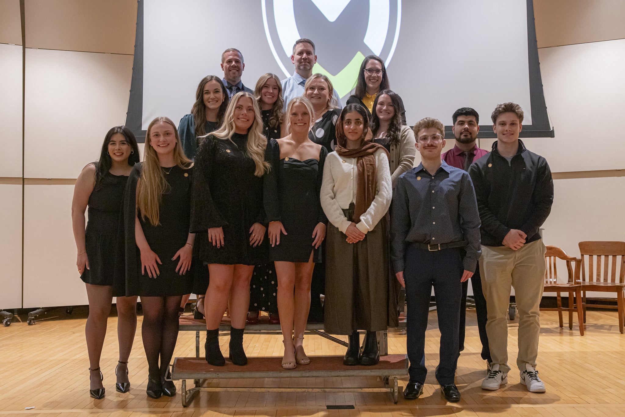 The ABSN Class of 2025 stands together at the annual pinning ceremony.
