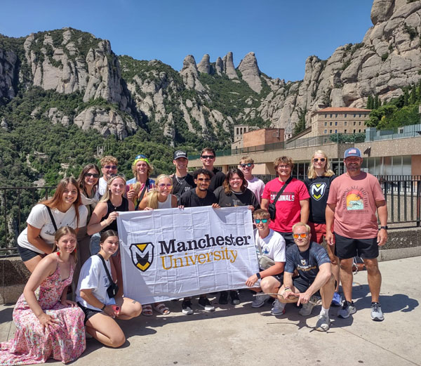 Students with Dr Jeff Beer on the Study Away Program visit a rock formation