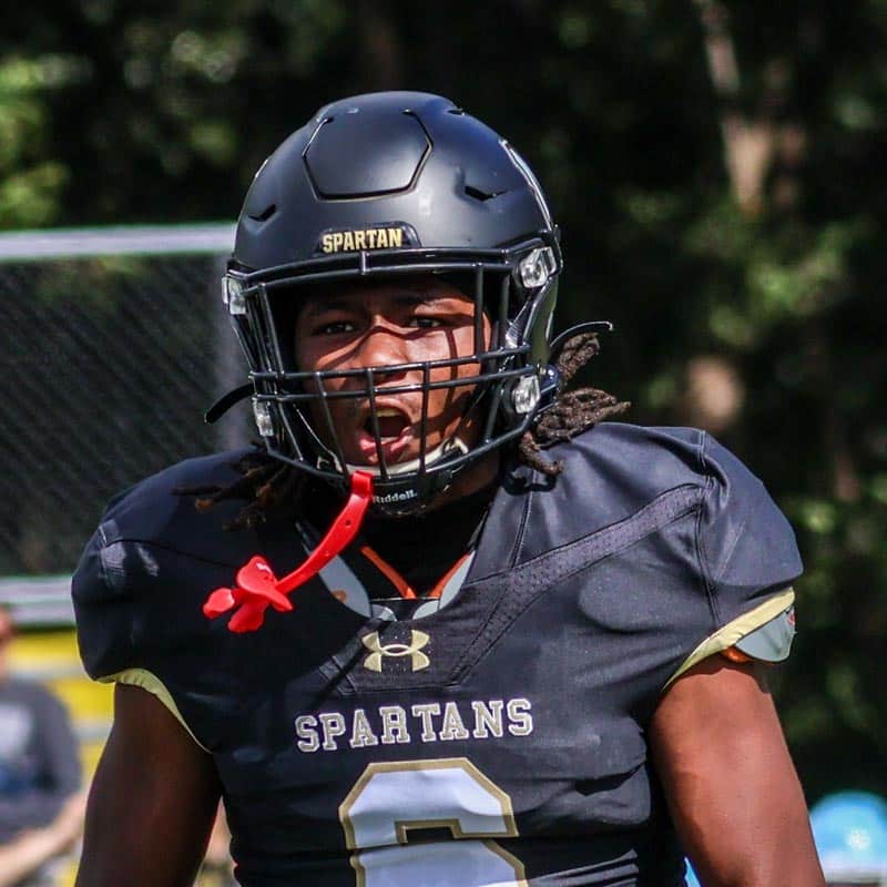 An MU Spartan Football player shows his excitement flexing and yelling after a touchdown to psych himself up.