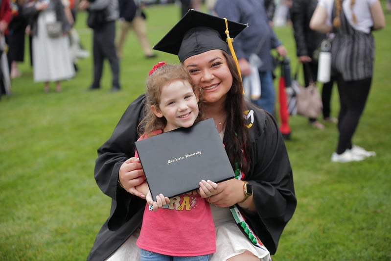 A student with her daughter displayed on graduation day.