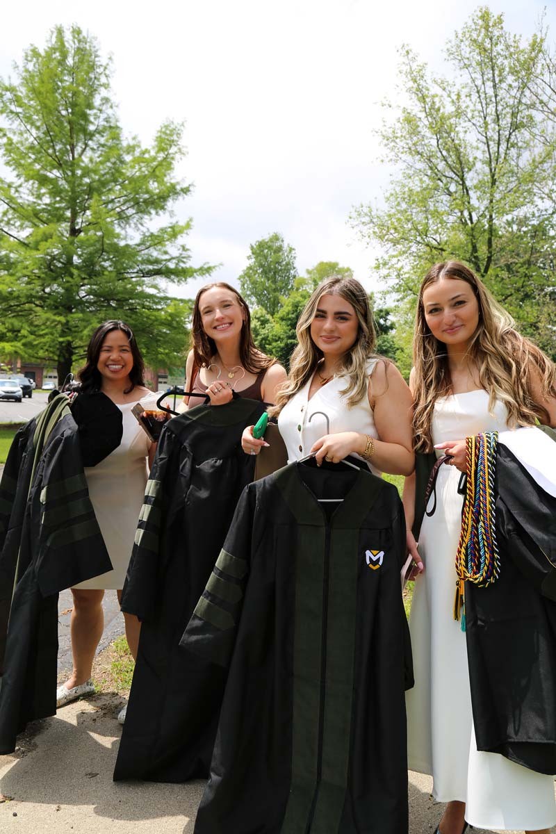 4 female graduate students get ready for the big day! 